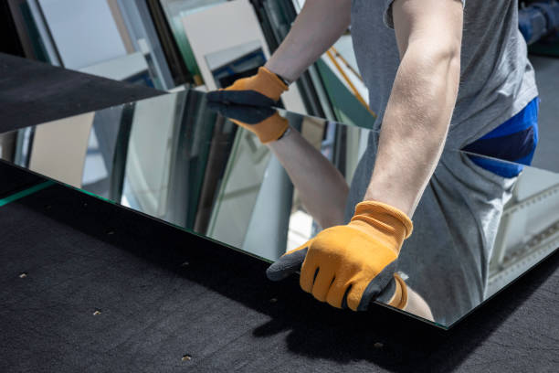 Person handling a large mirror