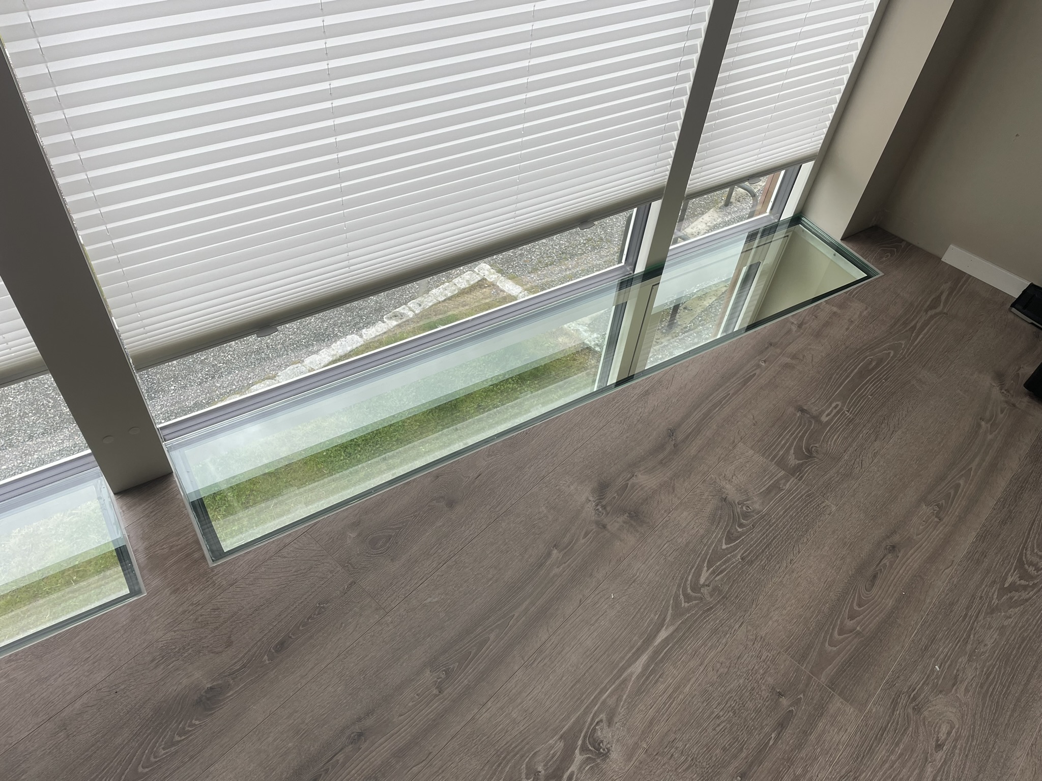 Glass window ledge with wooden floor